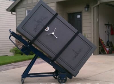 A large safe on a moving dolly.