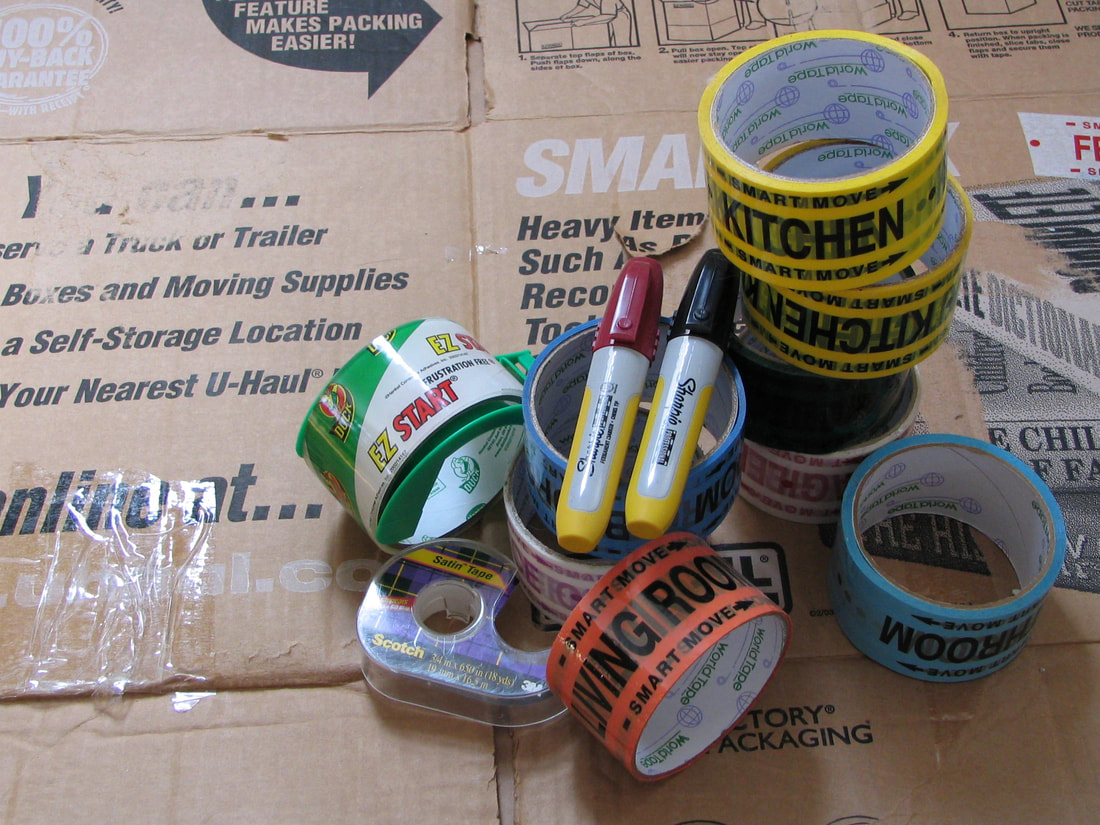 Packing tape and markers for packing and labeling.